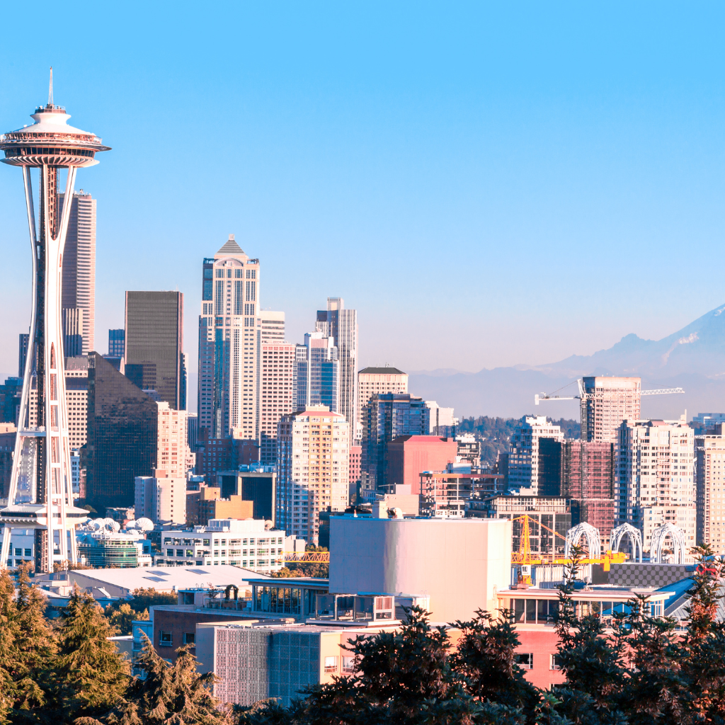 Seattle skyline with the Space Needle and downtown skyscrapers against a clear blue sky